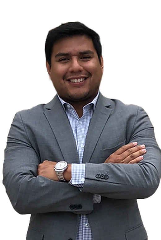 Attorney Juan Mendez Babani, Esq. in a suit with arms crossed